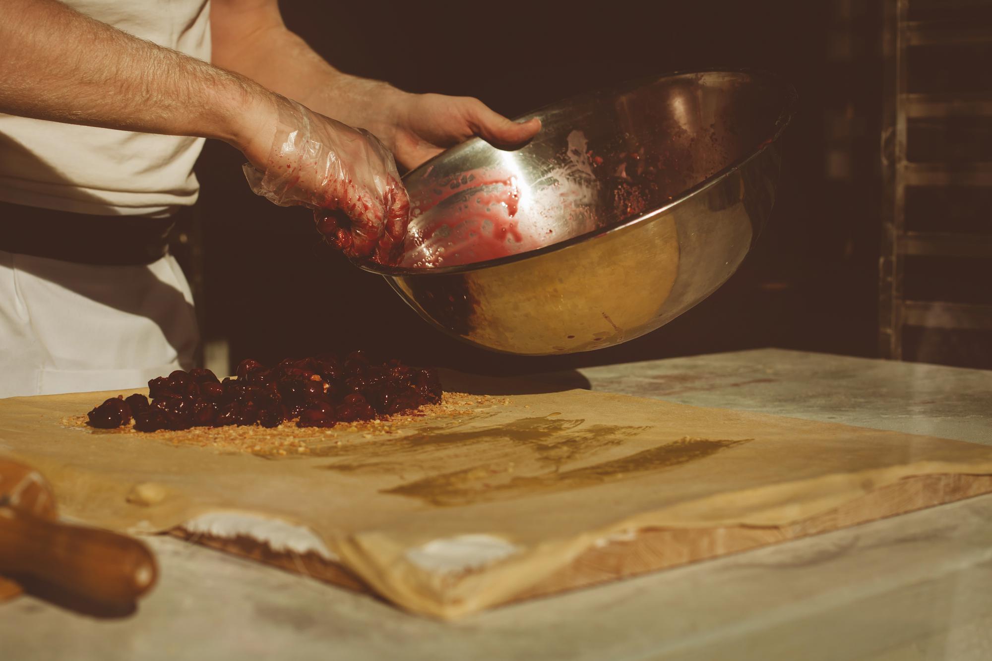 Artisan chef preparing meal in warm kitchen