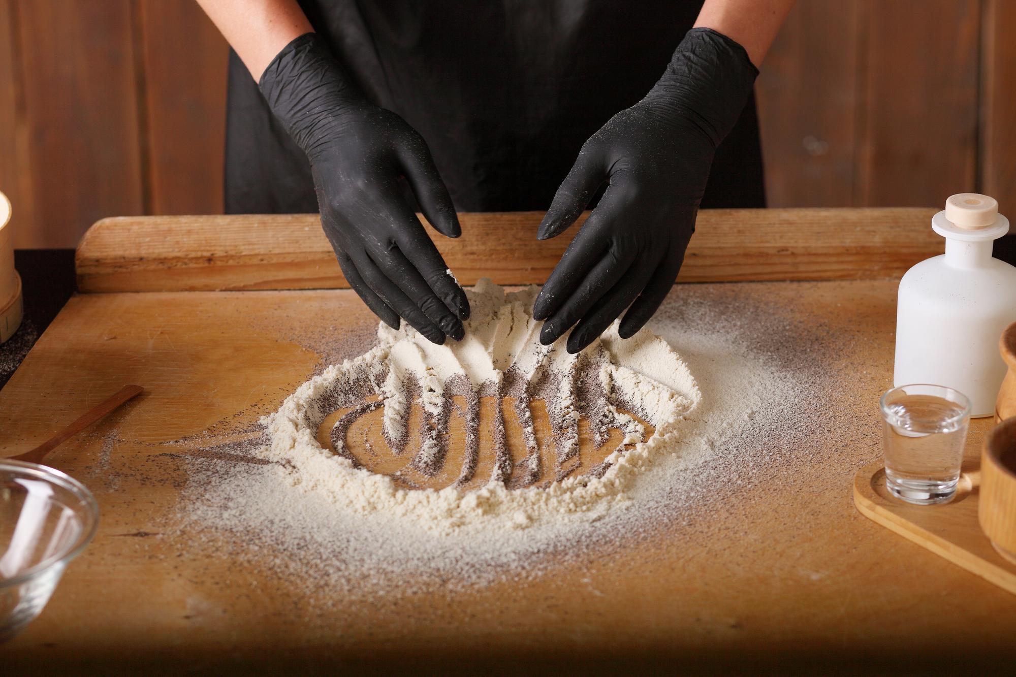 Hands shaping fresh pasta